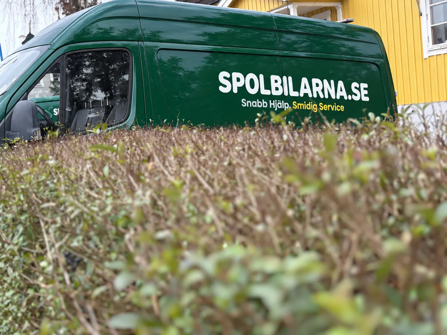 Spolbilarnas gröna spolbil med texten Snabb hjälp, smidig service